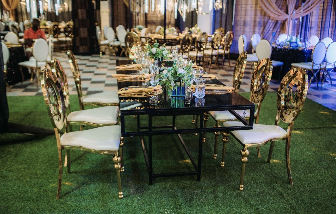 Hanging floral chandelier installation over reception table